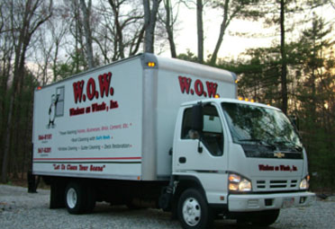 A white truck with the words " wow water at work, inc ".